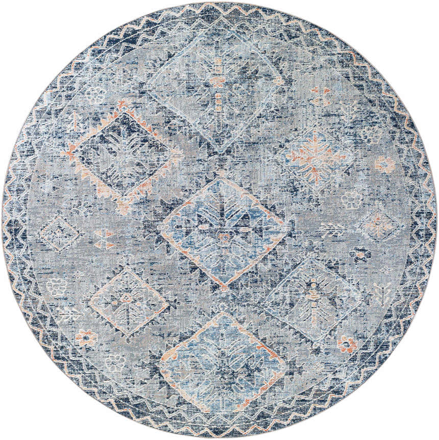 Close-up of a round Balamban Area Rug. Bohemian style, with brick red, cream, denim, gray, light beige, and navy colors. Design-Round-710