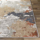 Close-up of the Balerno Area Rug showing its contemporary charcoal, blue, terracotta, and gray abstract design. Front
