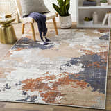Living room scene with Balerno Area Rug in charcoal, blue, gray, mustard, terracotta, and white. Contemporary style. Roomscene-Rectangle