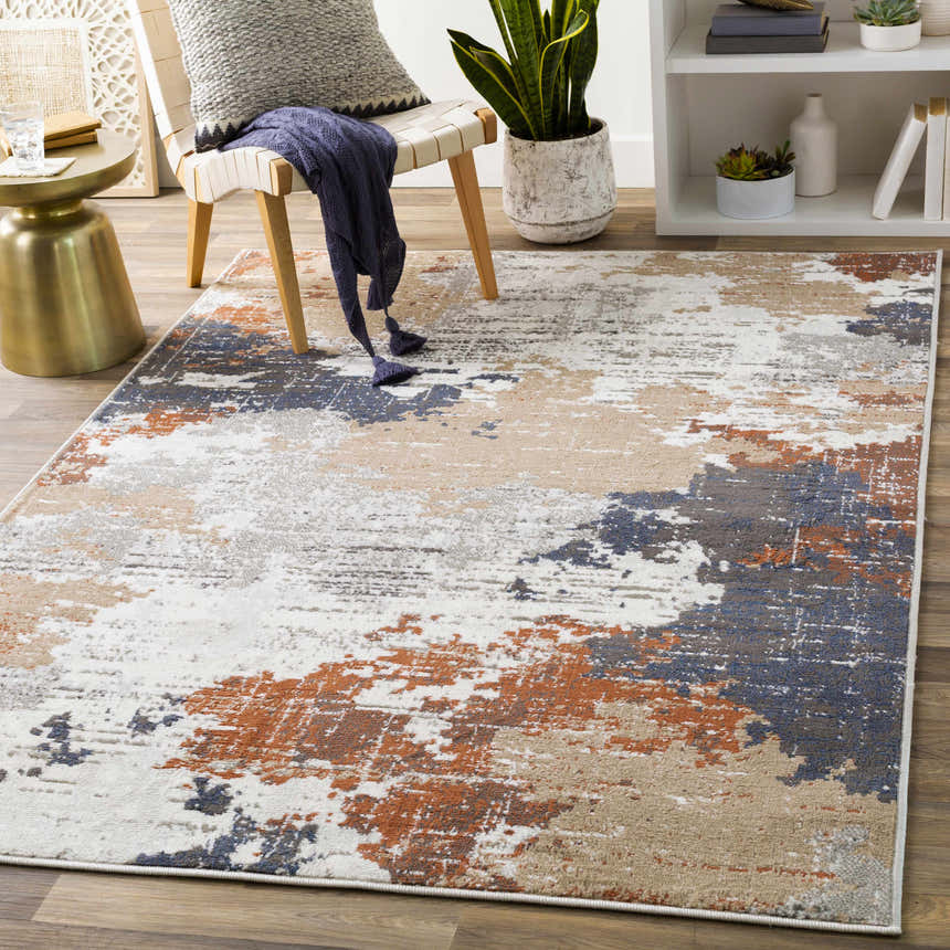 Living room scene with Balerno Area Rug in charcoal, blue, gray, mustard, terracotta, and white. Contemporary style. Roomscene-Rectangle