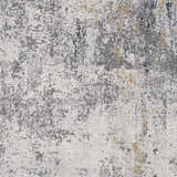 Close-up of the Baranduda Abstract Gray Luxe Rug, featuring charcoal, light gray, and beige abstract patterns. Swatch