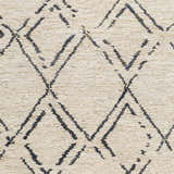 Close-up of the Barlig Beige Trellis Jute Carpet showing its hand-woven texture and black geometric trellis pattern. Swatch
