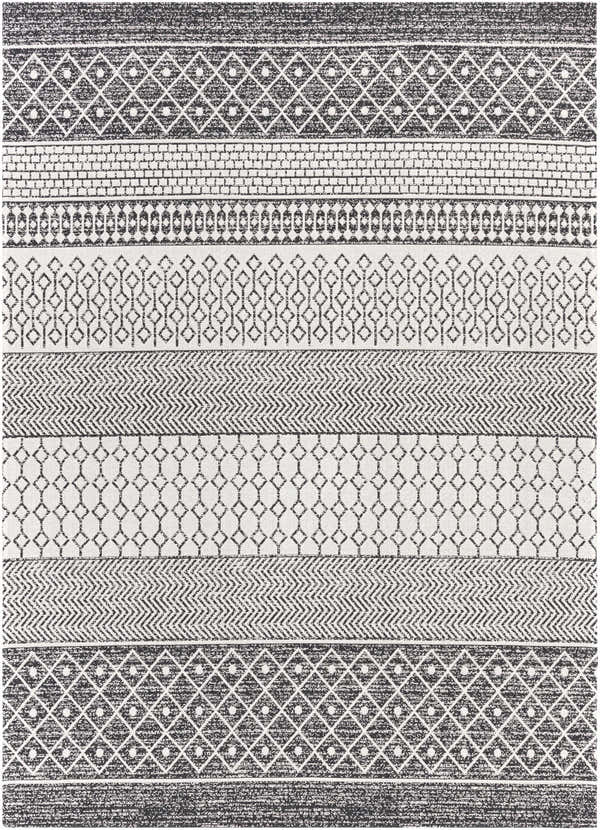 Close-up of the Barnwood Washable Area Rug. Black and cream cotton rug with Bohemian-inspired geometric patterns. Design-Rectangle-710102