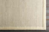 Close-up of the hand-tufted Barrow Wool Rug. Cream and light gray rug with a solid and striped contemporary design. Corner