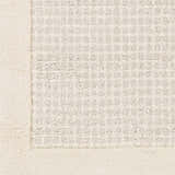 Close-up of the Barrow Wool Rug. Cream border and light gray textured pattern. Hand-tufted wool rug. Swatch