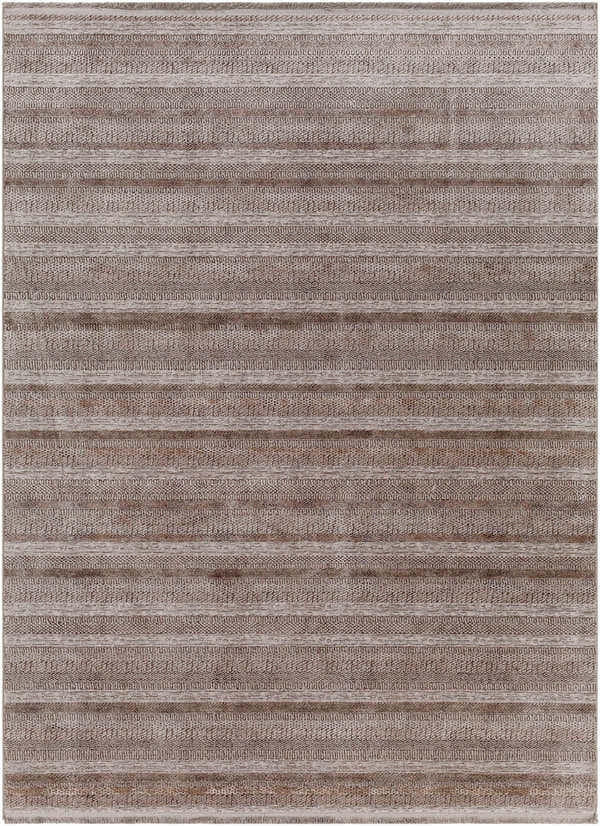 Close-up of the Batarasa Area Carpet. Charcoal, light and medium gray stripes with a subtle textured pattern. Design-Rectangle-5373