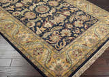 Close-up of the hand-knotted Bays Area Carpet. Traditional floral design in amber, brown, ink blue, and brick red. Wool rug with fringe. Corner