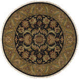 Close-up of round Bays Area Carpet. Traditional floral pattern in amber, brown, brick red, and ink blue. Hand-knotted wool rug. Design-Round