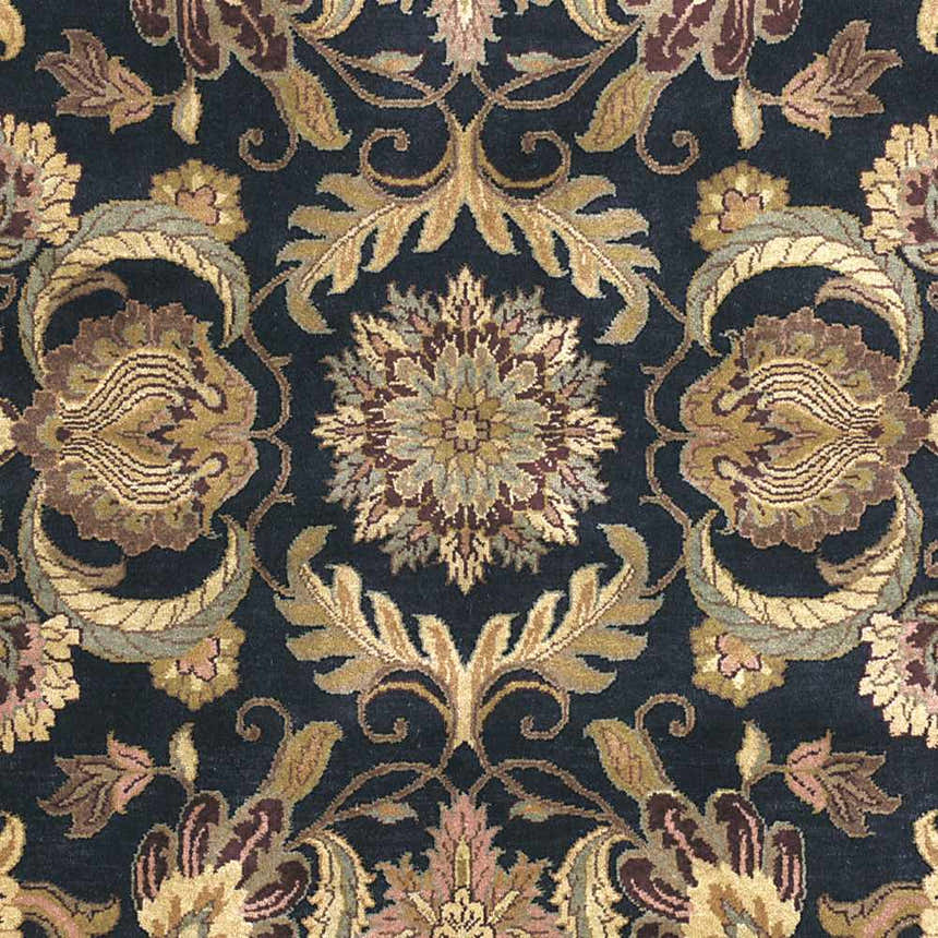 Close up of the Bays Area Carpet, a traditional rug with amber, brown, and blue floral patterns. Swatch