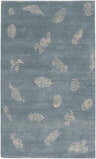 Close-up of the Beach Area Carpet, a hand-knotted wool rug with a light gray seashell pattern on a blue-gray background. Design-Rectangle-58