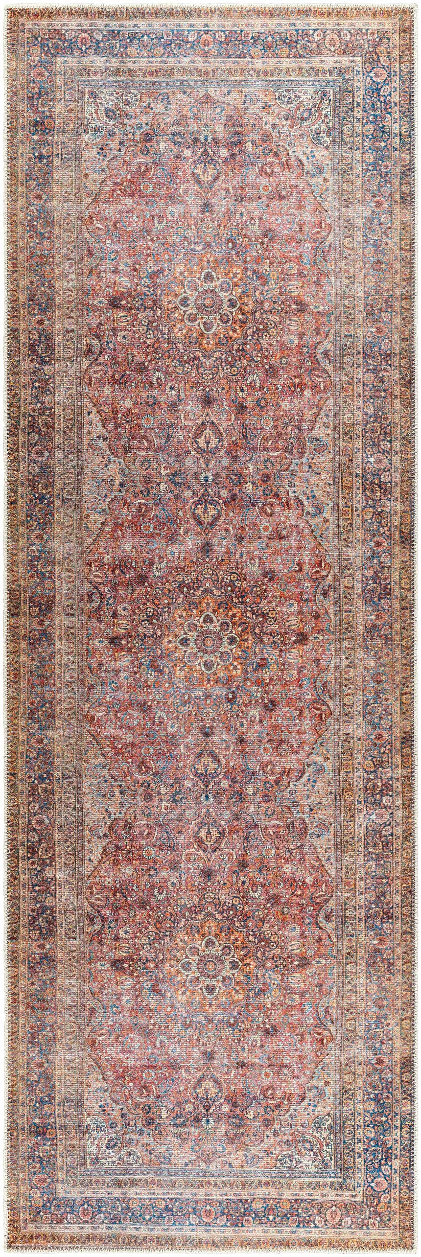Close-up of the Belison Washable Area Rug. Traditional rug design in red, orange, and blue hues with a detailed floral pattern. Design-Runner-27710