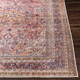 Close up of the Belison Washable Area Rug. Farmhouse style with traditional floral pattern in red, orange, and blue tones. Front