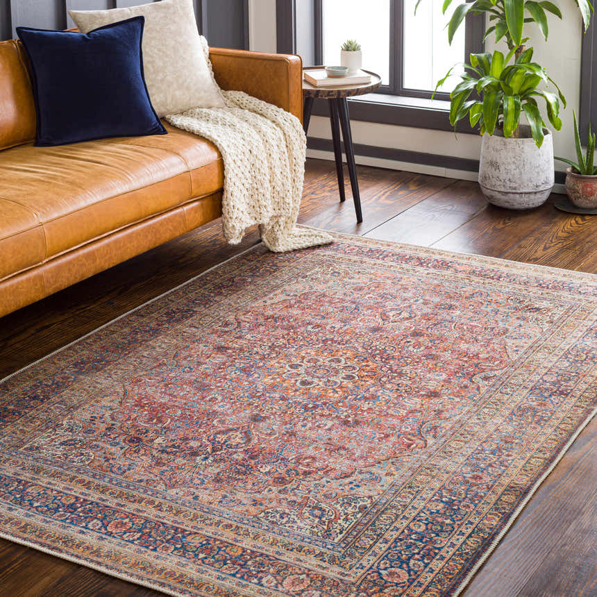 Living room scene with a Belison Washable Area Rug, brown leather sofa, throw blanket, and plants. Farmhouse style. Roomscene-Rectangle