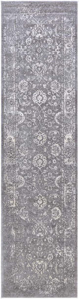 Close-up of a Benavides Gray Updated Traditional Tibetan Rug, showcasing its charcoal, gray, and ivory floral pattern and soft texture. Design-Runner-2710