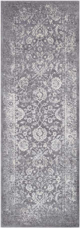 Close-up of the Benavides Gray Updated Traditional Tibetan Rug, showing the charcoal and ivory floral pattern. Design-Runner-2776