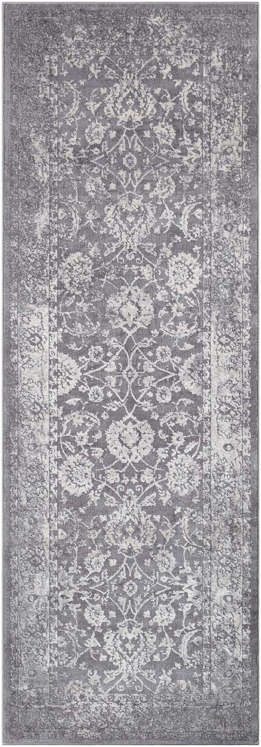 Close-up of the Benavides Gray Updated Traditional Tibetan Rug, showing the charcoal and ivory floral pattern. Design-Runner-2776