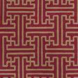 Close-up of Bentonville Area Carpet. Hand-woven wool rug with a geometric tan pattern on a brick red background. Swatch