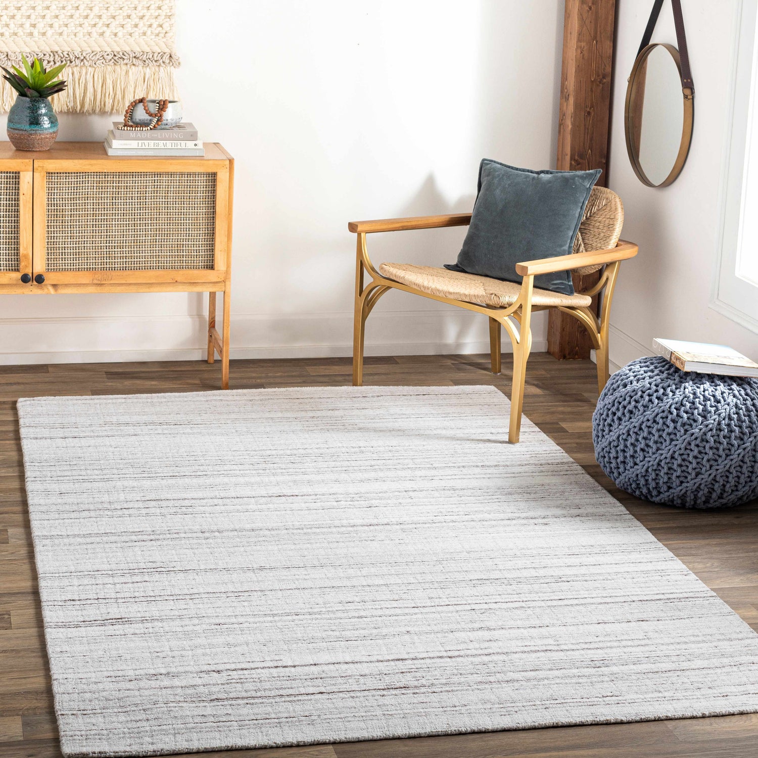 Living room scene with a cream and brown striped Beykoz Area Rug, wood floors, and natural light. Roomscene-Rectangle