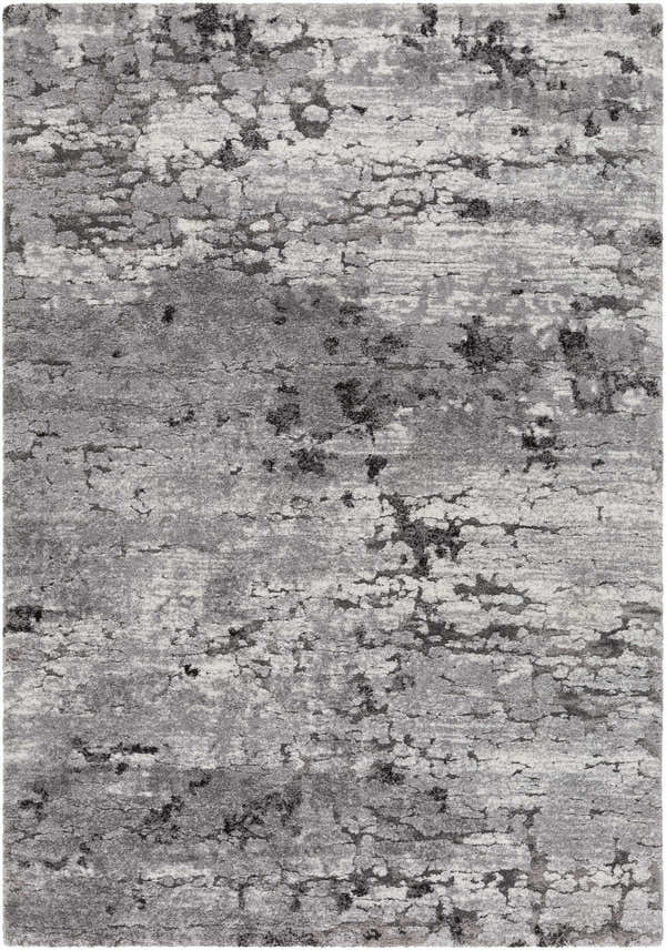 Close-up of the Bilston Boutique Thick Luxe Rug, showcasing its black, charcoal, gray, and ivory contemporary design. Design-Rectangle-5373
