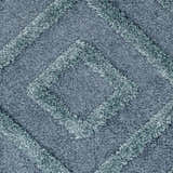 Close-up of the Binucayan Area Rug, a blue and navy shag rug with a diamond pattern texture. Clearance item. Swatch