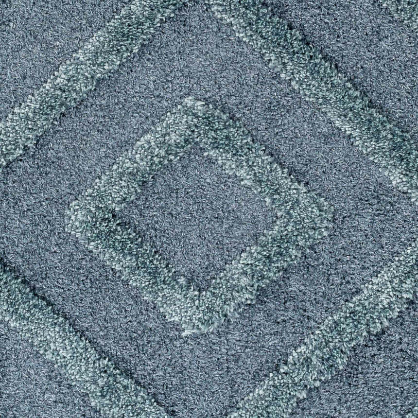 Close-up of the Binucayan Area Rug, a blue and navy shag rug with a diamond pattern texture. Clearance item. Swatch