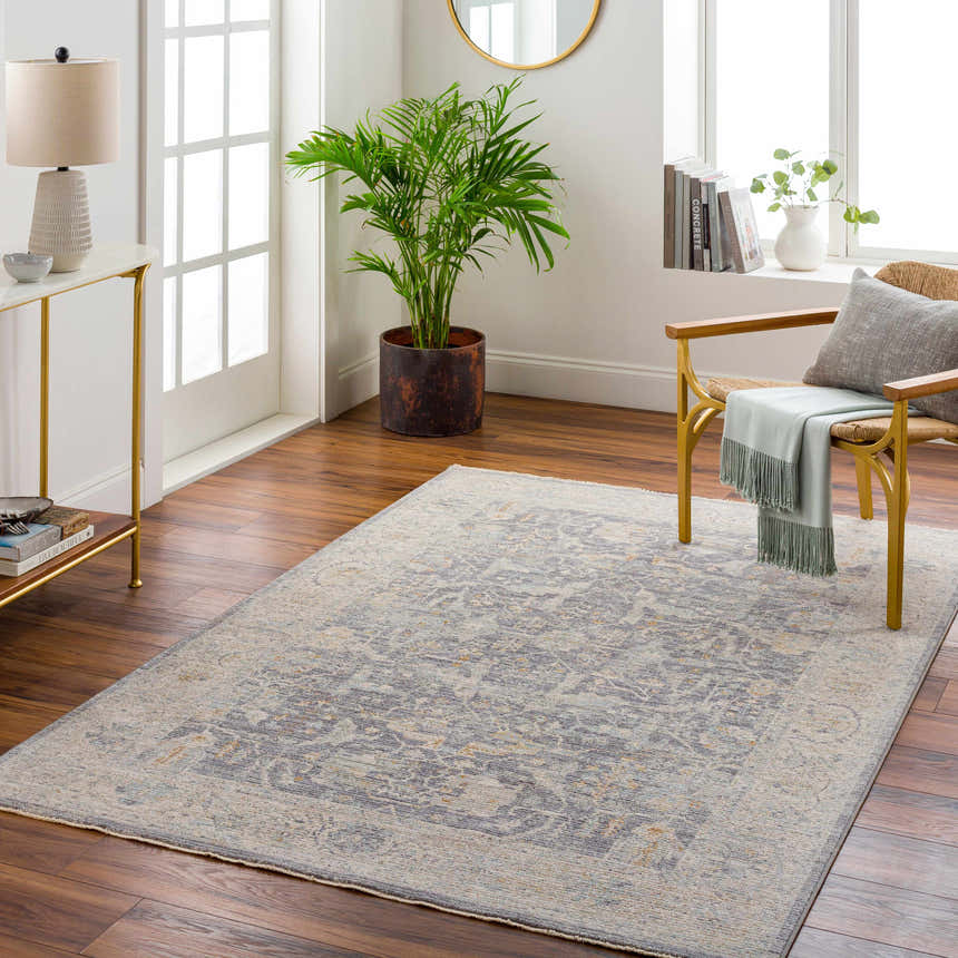 Living room with Binx Thick Luxe Statement Rug in brown, charcoal, dusty sage, and gray. Transitional style with gold accents. Roomscene-Rectangle