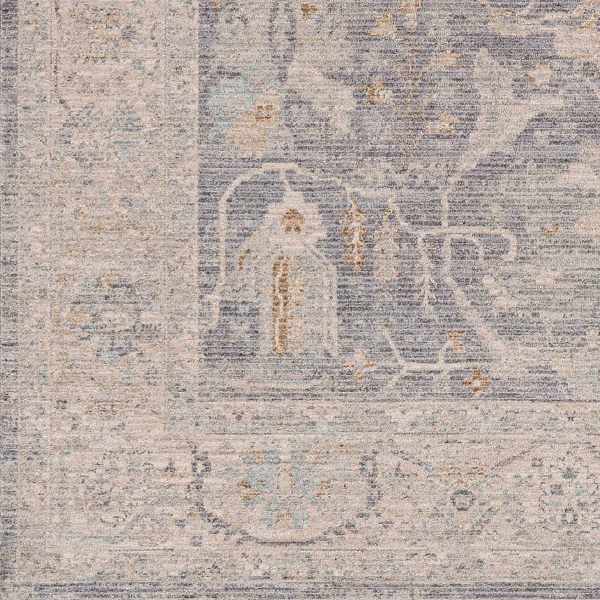Close-up of Binx rug showing traditional design in brown, charcoal, dusty sage, medium gray, and teal. Luxe texture. Swatch