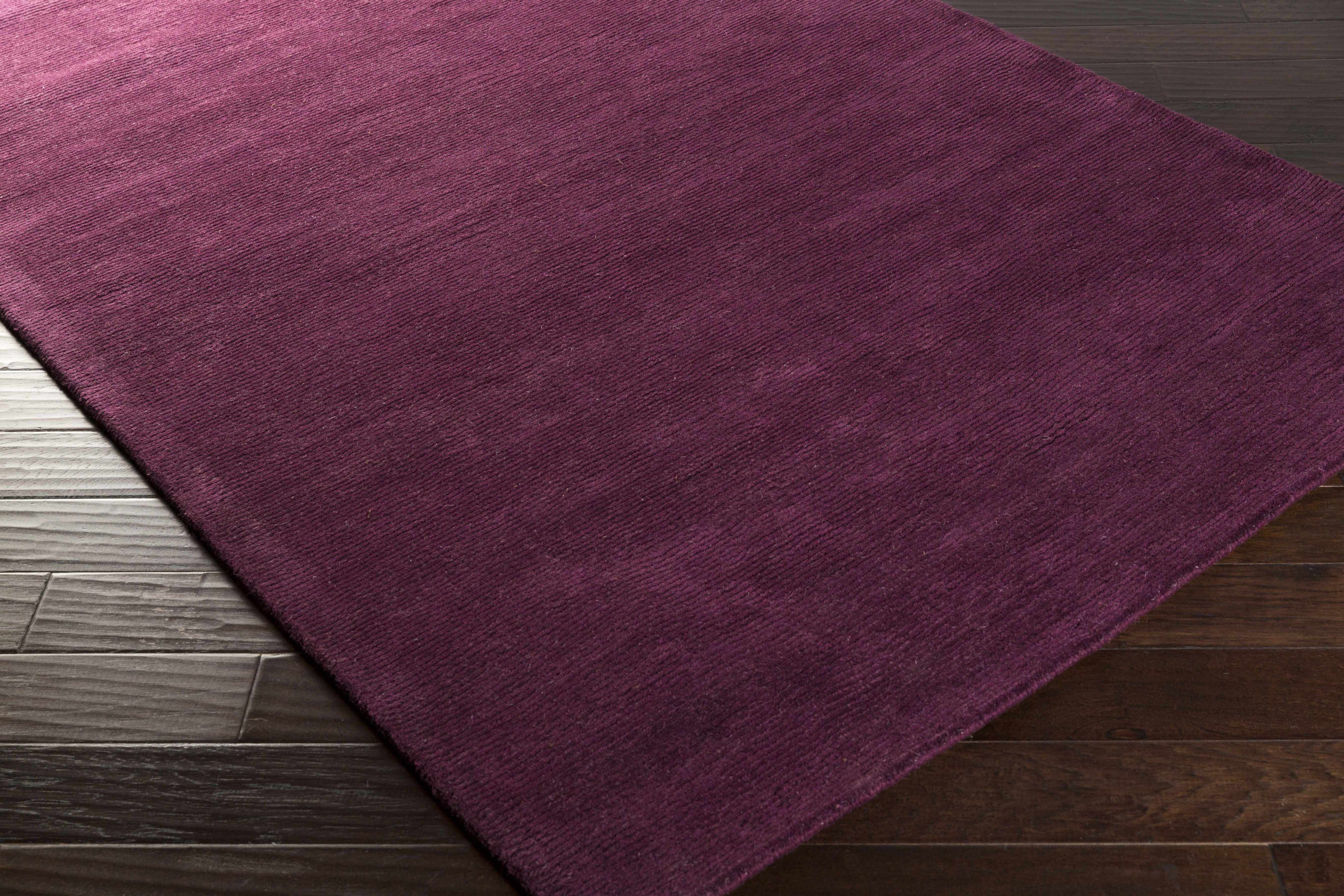 Zoomed-in view of the edge of Biola Area Rug - Clearance, focusing on border details and craftsmanship. Contemporary Area Rug Backing Canvas 