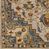 Close-up of the hand-tufted Birtley Area Rug. Features a traditional floral pattern in blue, brick red, camel, and olive tones. Swatch