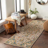 Entryway scene with Birtley Area Rug, a vintage style runner with blue, tan, and rust hues, paired with a wood bench and woven pouf. Roomscene-Runner