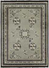 Detailed Bixby Area Rug close-up showing floral and geometric patterns in black, sage, beige, and gray wool. Design-Rectangle-811
