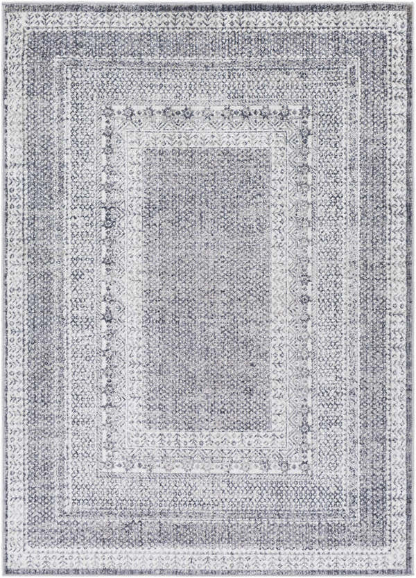 Close-up of the Blarney Area Rug, a machine-woven rectangle in charcoal, cream, and gray with a traditional, geometric pattern. Design-Rectangle-537