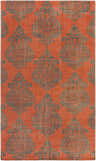 Close-up of the Blackduck Area Carpet - Clearance. Hand-knotted wool rug with charcoal damask pattern on a coral background. Design-Rectangle