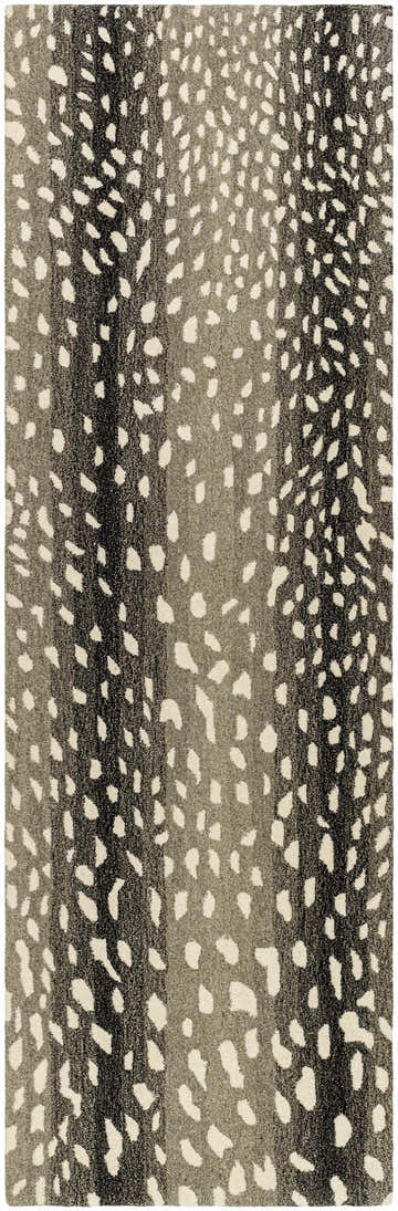 Close-up of the Athena Giraffe Print Wool Rug. Beige, charcoal, and brown tones with a unique animal-inspired pattern. Design-Runner-268