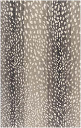 Close-up of the Athena Giraffe Print Wool Rug, featuring a beige and charcoal animal print design. Hand-tufted texture. Design-Rectangle-58