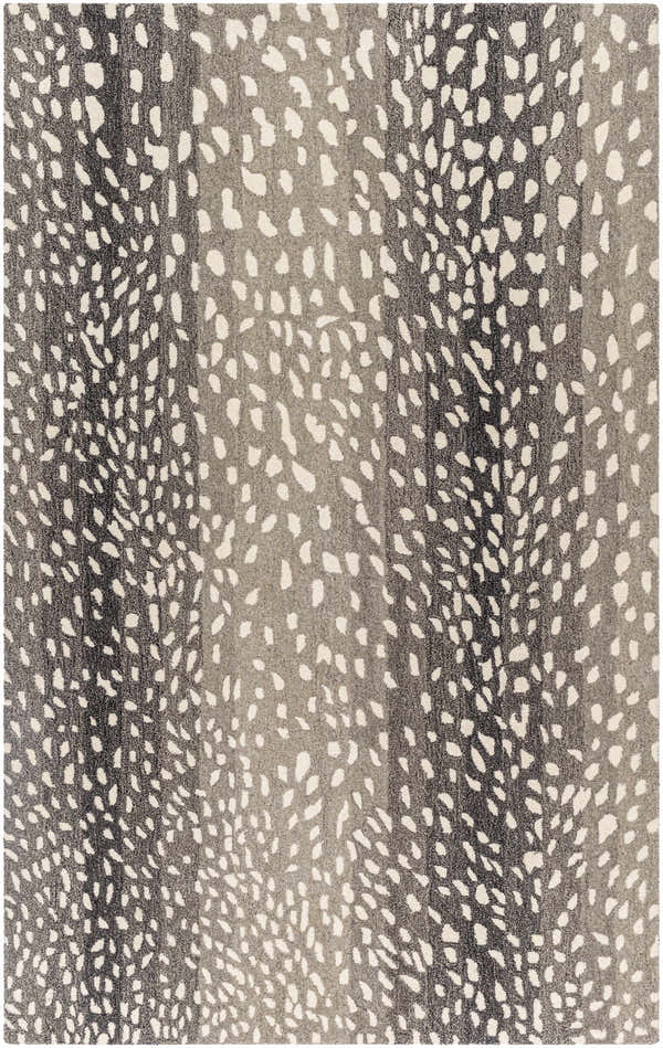 Close-up of the Athena Giraffe Print Wool Rug, featuring a beige and charcoal animal print design. Hand-tufted texture. Design-Rectangle-58