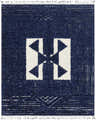 Close-up of the Billinge Area Carpet. Hand-knotted 100% wool rug in cream and navy with a geometric, bohemian design and fringe. Design-Rectangle-810