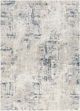 Close-up of the Balasing Area Rug - Clearance. Contemporary style in dark gray, ivory, and blue with a subtle geometric pattern. Design-Rectangle-537