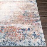 Close-up of the Bonaventure Area Rug, a contemporary rug in charcoal, red, gray, and navy on dark wood floors. Front