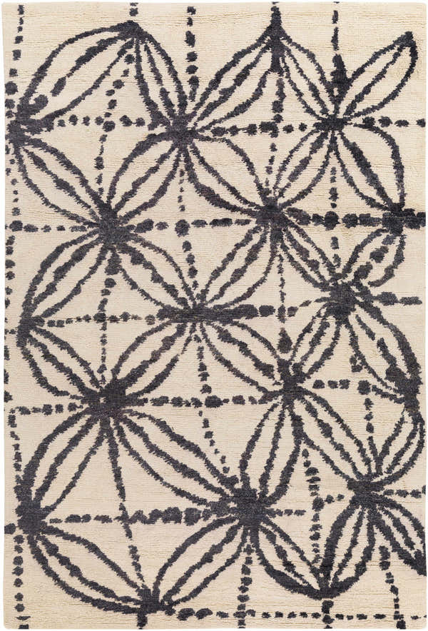 Close-up of Bonnyman Jute Carpet. Hand-woven rug with black floral pattern on ivory jute. Contemporary style. Design-Rectangle-576