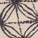 Close-up of the Bonnyman Jute Carpet showing its ivory background and black geometric pattern, hand woven texture. Swatch