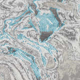 Close-up of the Bonville Blue Marble Rug, featuring a swirling abstract pattern in blue, cream, light beige, and gray. Swatch
