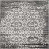 Close-up of the Bowden Carpet in charcoal, light gray, and white. Traditional floral medallion design with distressed texture. Design-Square-53