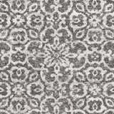 Close-up of Bowden Carpet - Clearance. Charcoal, light gray, and white floral pattern. Farmhouse style rug texture. Swatch