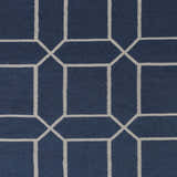 Close-up of the Bowdon Area Rug. Navy rug with a geometric white pattern. Contemporary style. Swatch
