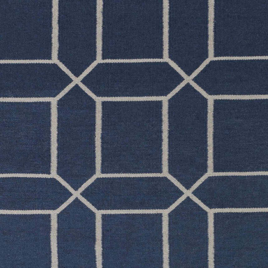Close-up of the Bowdon Area Rug. Navy rug with a geometric white pattern. Contemporary style. Swatch