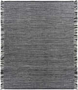 Close-up of the Boyden Black Area Rug with Tassels. Hand-woven rug in black and cream with a textured, contemporary design. Design-Rectangle-810