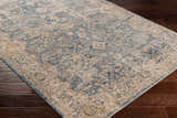 Close-up of the Barcelona Luxe Performance Rug. Features a traditional oriental pattern in shades of blue, beige, and mustard. Corner
