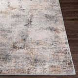 Close up of the Braddyville Area Rug showing its black, brown, cream, and gray contemporary design. Front