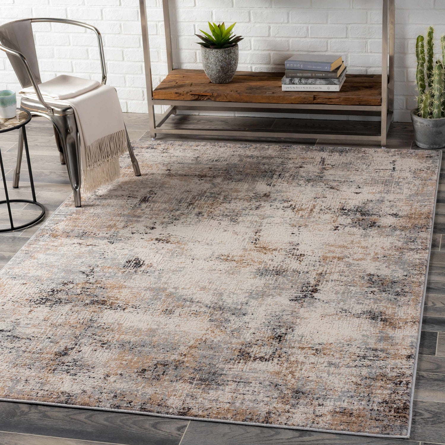 Modern dining room with a Braddyville Area Rug in cream, gray, brown, and black. Metal chair and wood shelf. Roomscene-Rectangle